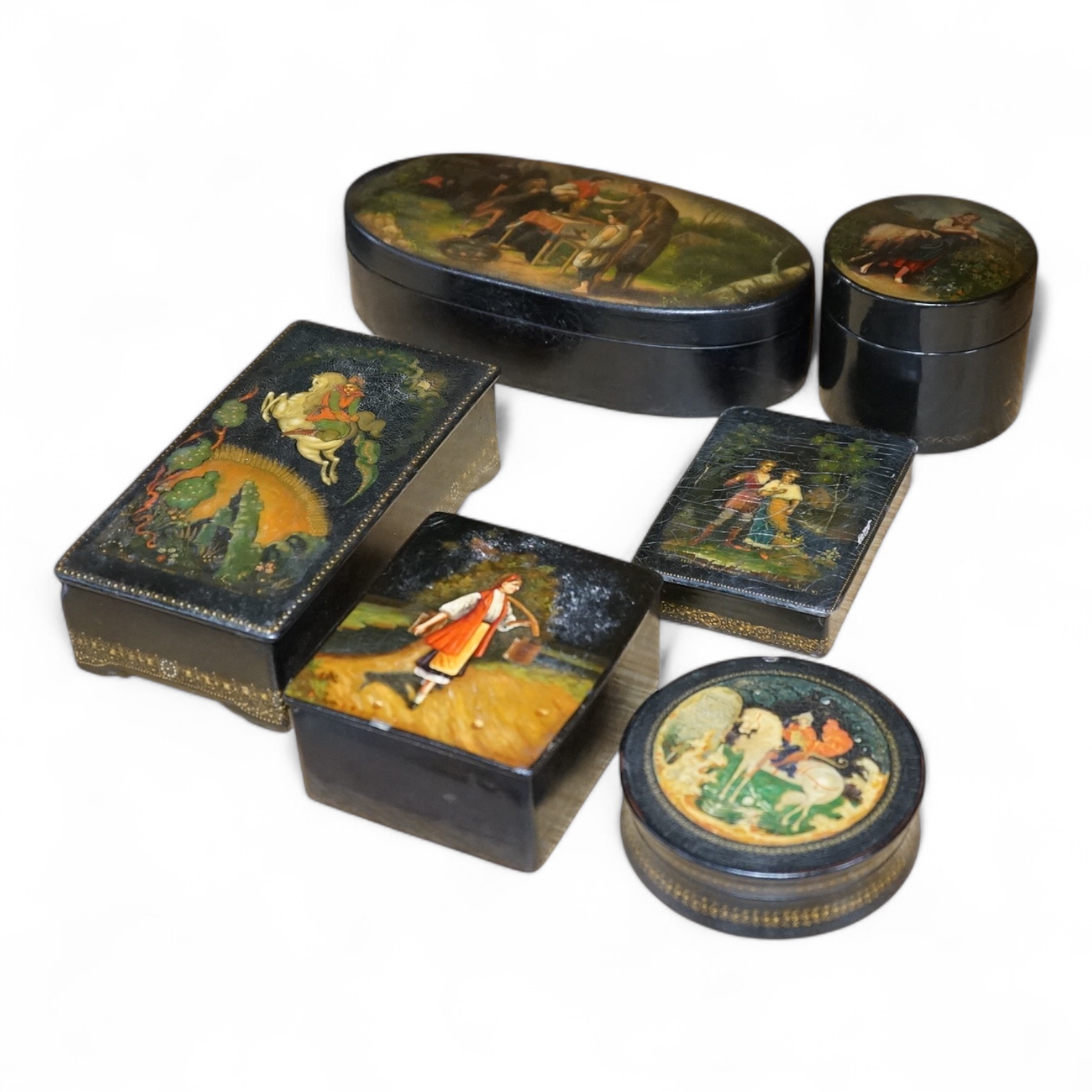 Six late 19th / 20th century Russian lacquer boxes to include two signed examples, largest 20cm. Condition - varies